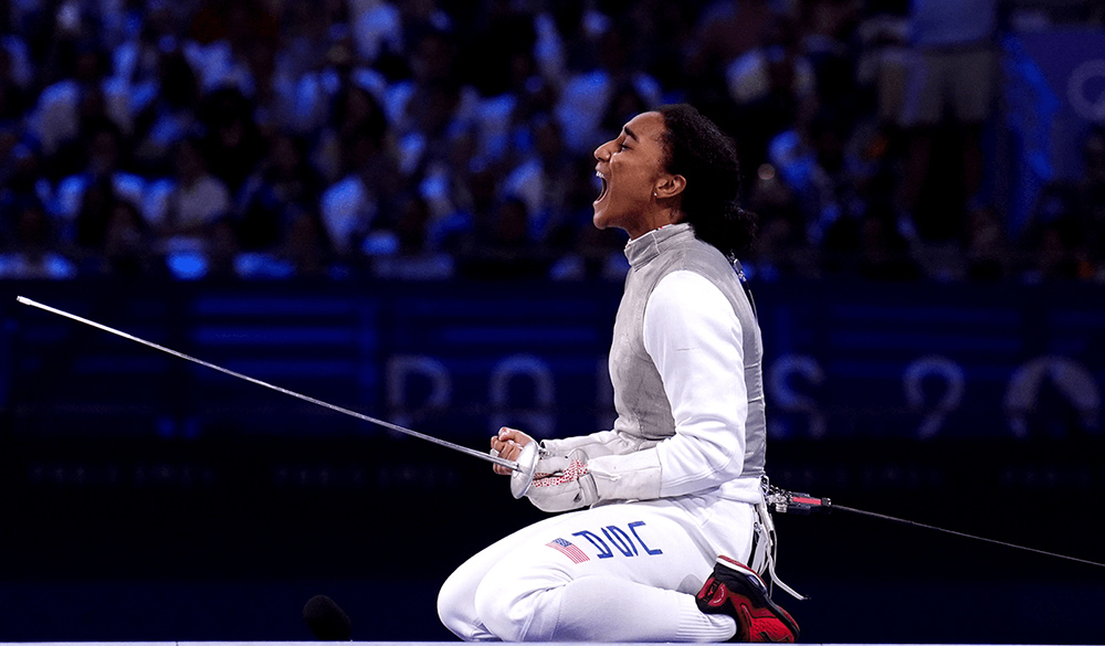 USA’s Lauren Scruggs celebrates victory over Italy during the women’s foil team final 