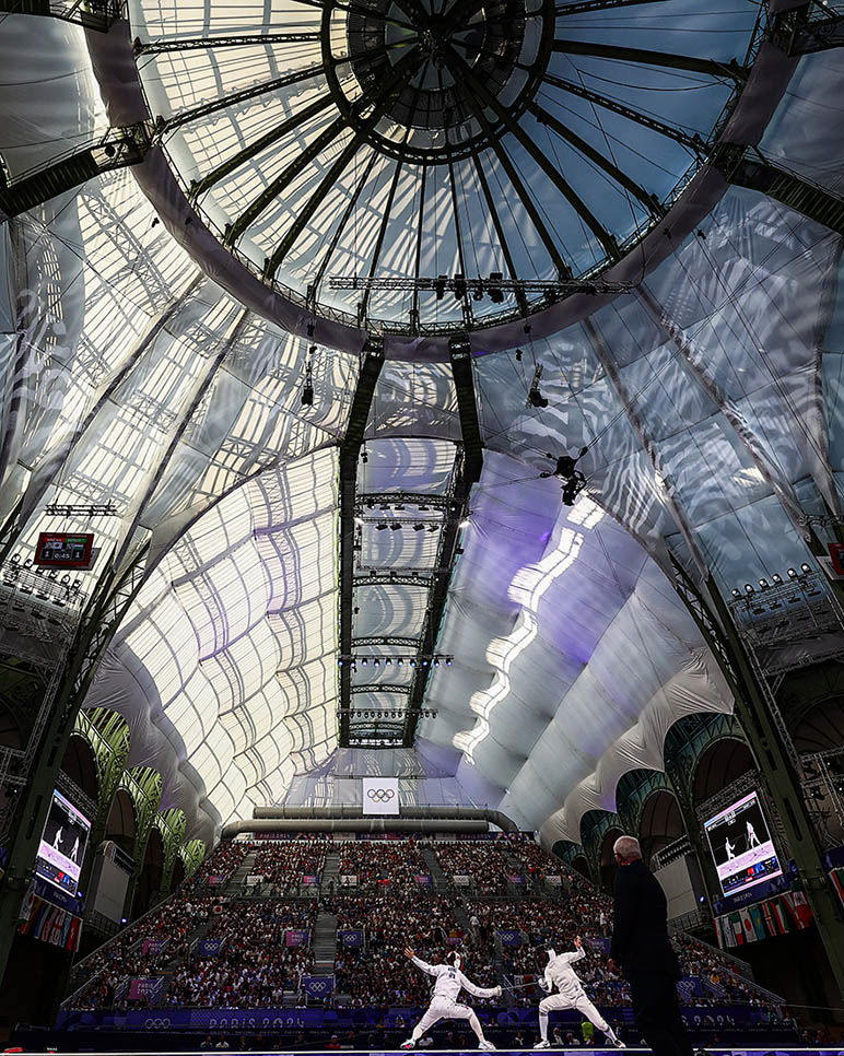 Japan's Koki Kano and Hungary's Tibor Andrasfi compete in the men's epee individual semi-final bout at the Grand Palais in Paris