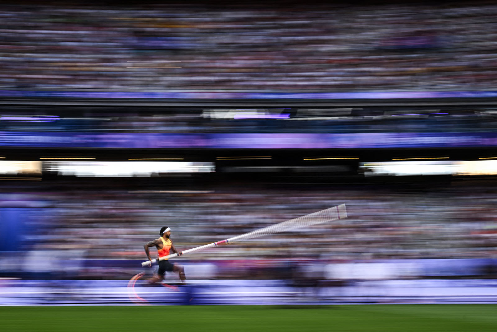 Germany's Bo Kanda Lita Baehre runs in the men's pole vault final