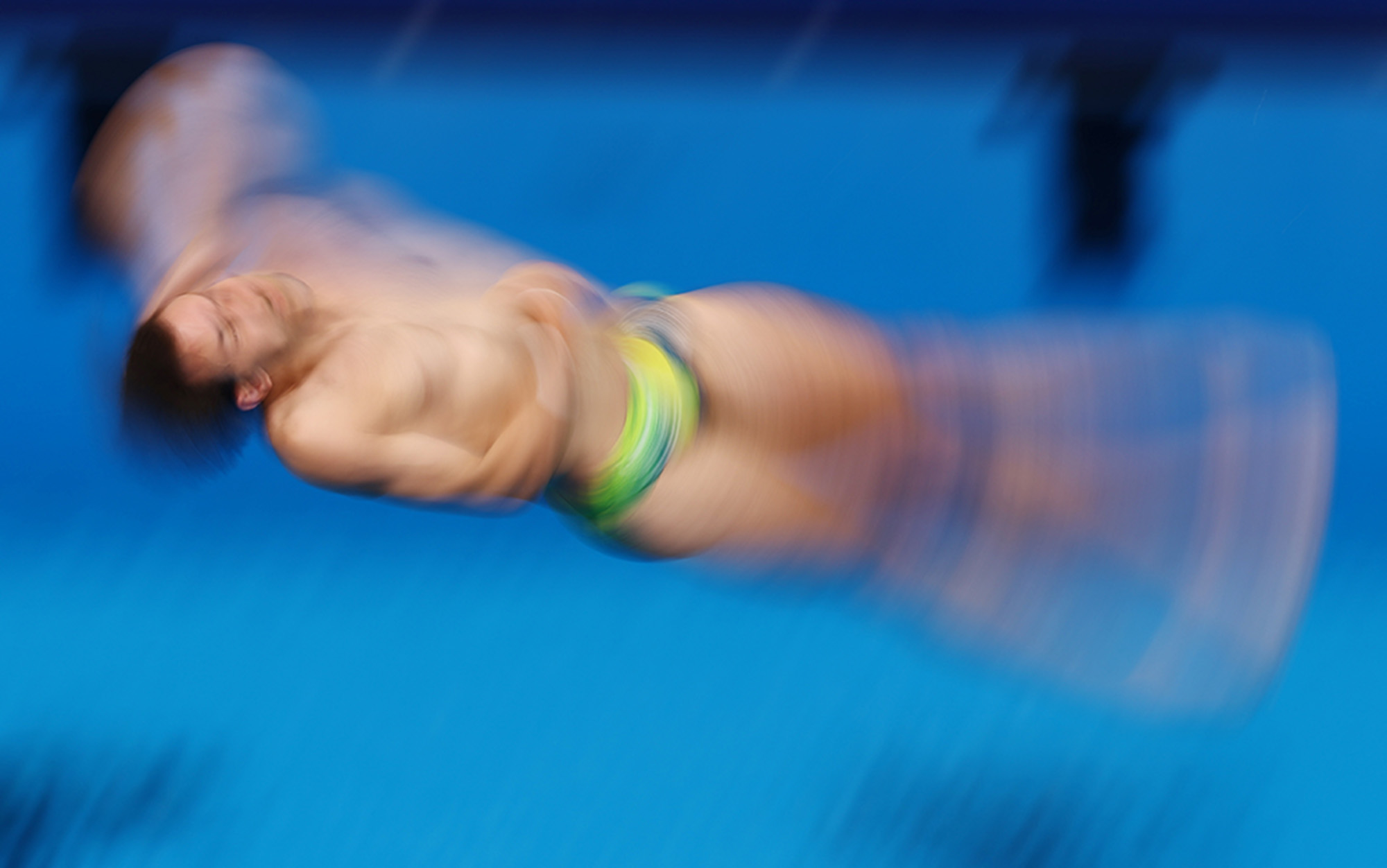 Kurtis Mathews of Australia in action in the Diving - Men's 3m Springboard Semifinal at the Aquatics Centre, Saint-Denis, France.