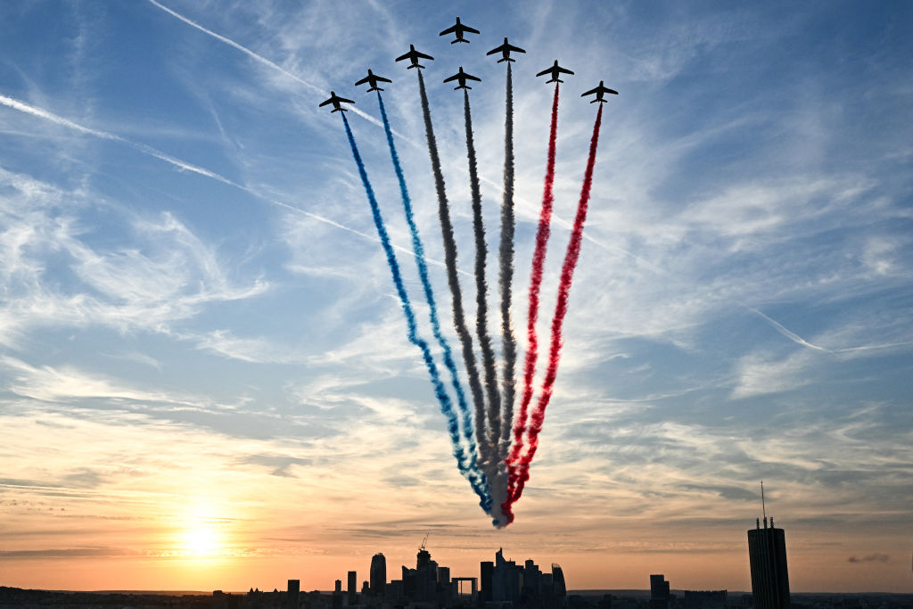 Elite acrobatic flight team of the French Air Force "Patrol of France" performs over La Defense during the opening ceremony of the 2024 Paralympic Games in Paris on August 28, 2024