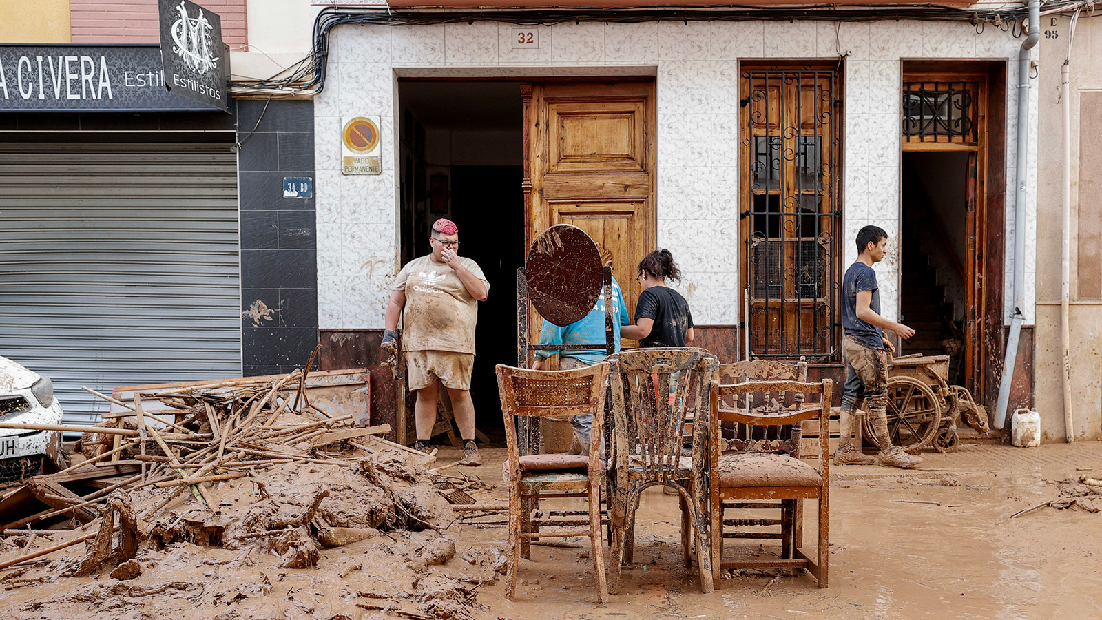 Residents salvage furniture in the flood-hit municipality of Paiporta