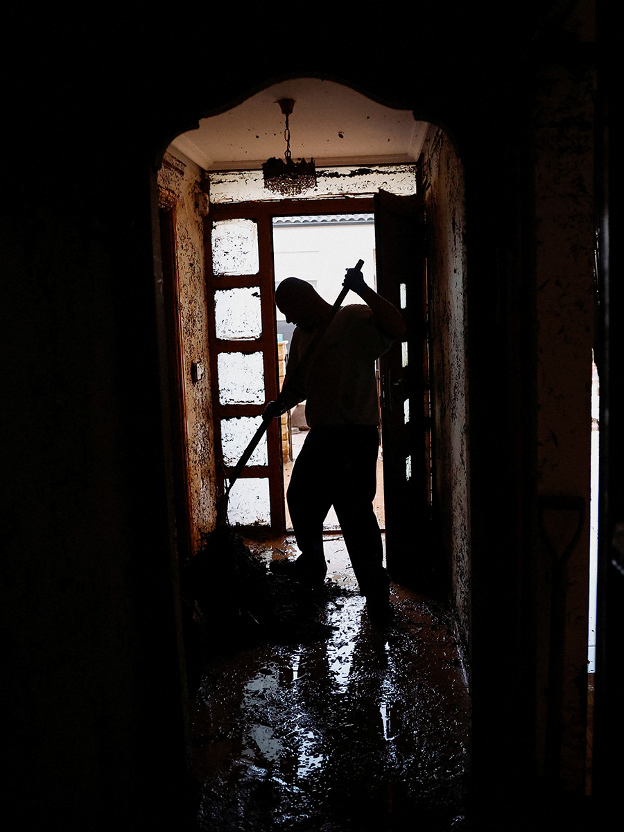 Silohuette of a man cleaning out his house near Valencia