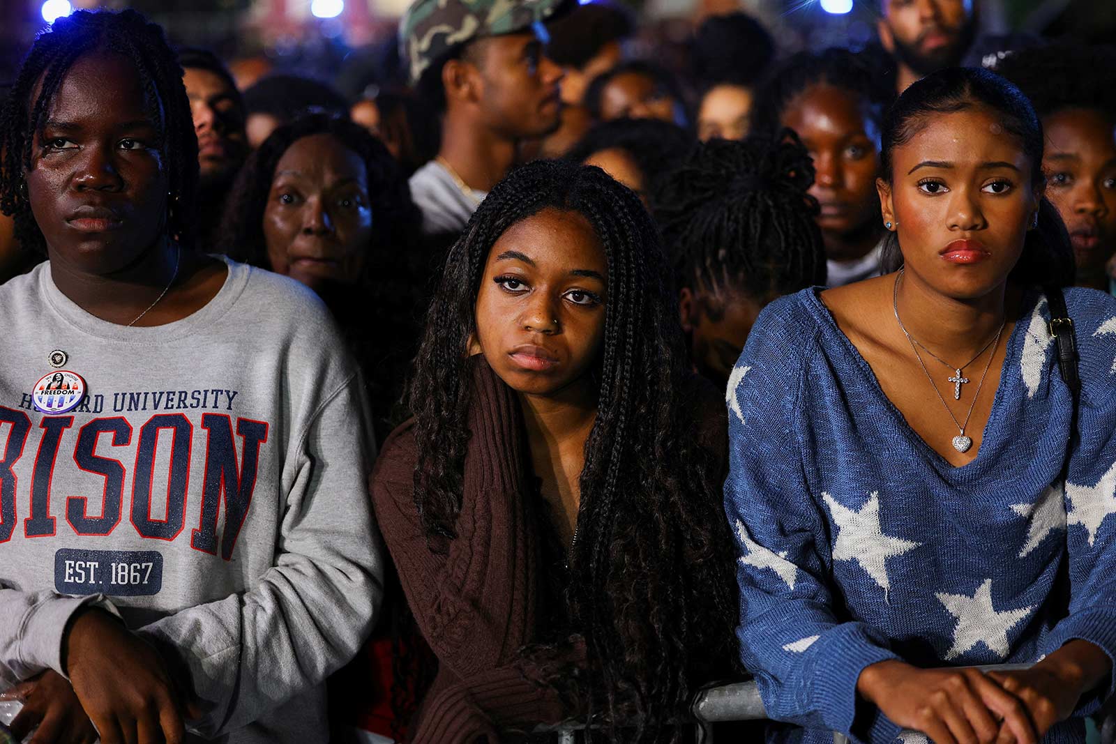 Attendees react to negative results at the election night party at Howard University in Washington DC (Kevin Mohatt/Reuters)