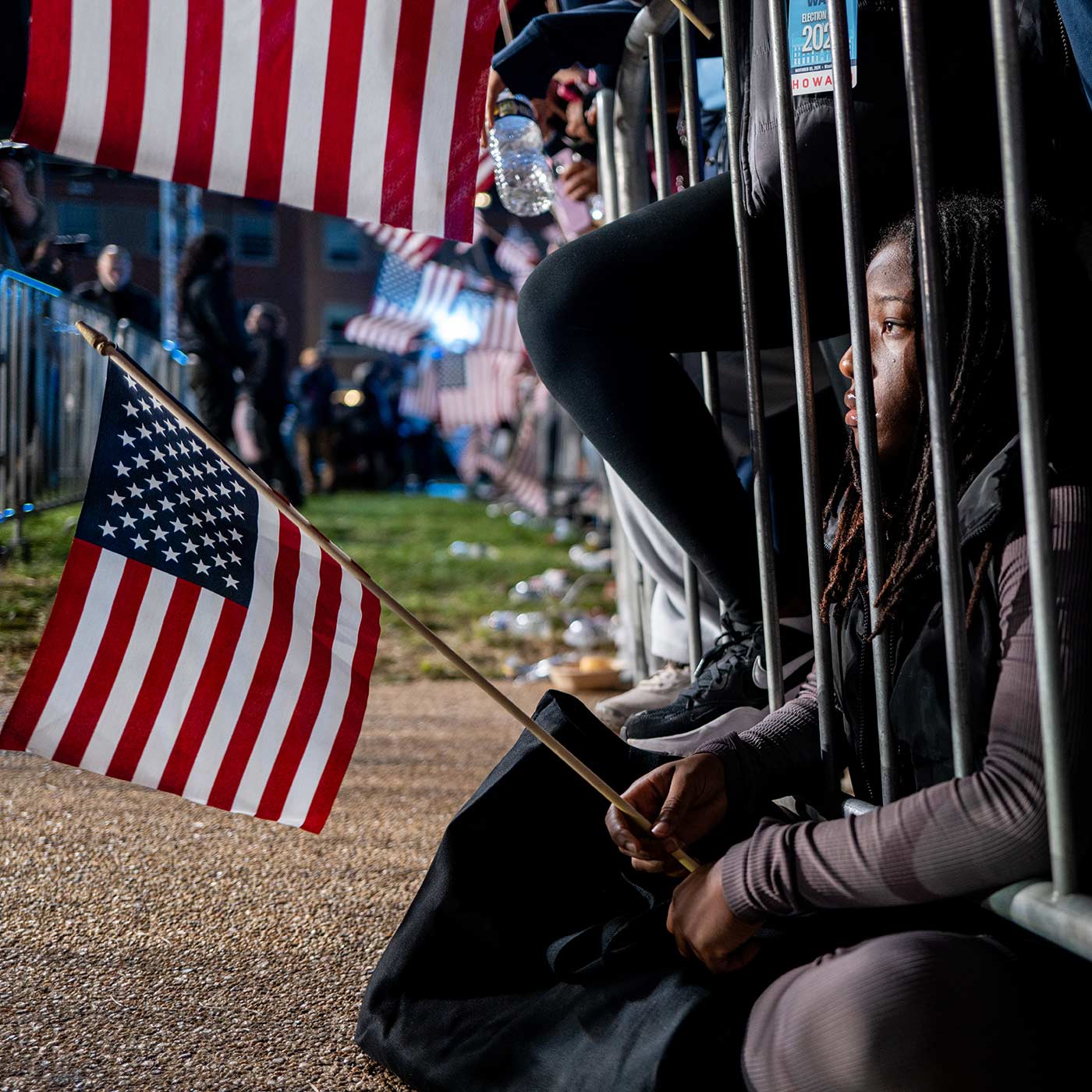 A Howard University student sitting on the ground at the Harris campaign's election night watch party in Washington DC (Brandon Bell/Getty Images)