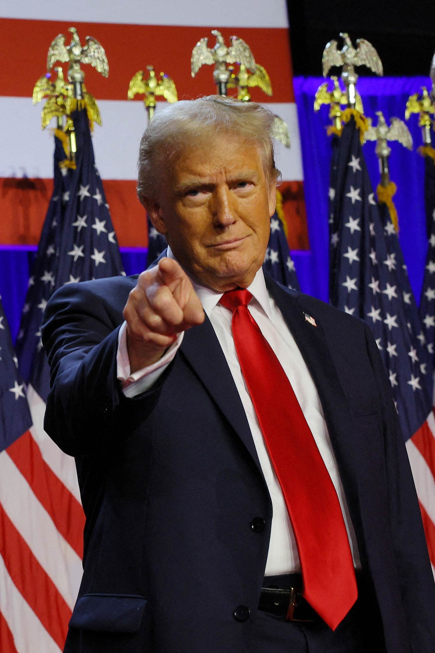 Donald Trump takes the stage at the Palm Beach County Convention Center in Florida (Brian Snyder/Reuters)