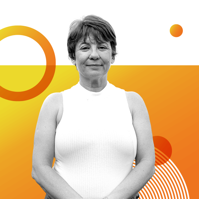 Biologist Silvana Santos with short hair and wearing a white sleeveless top.