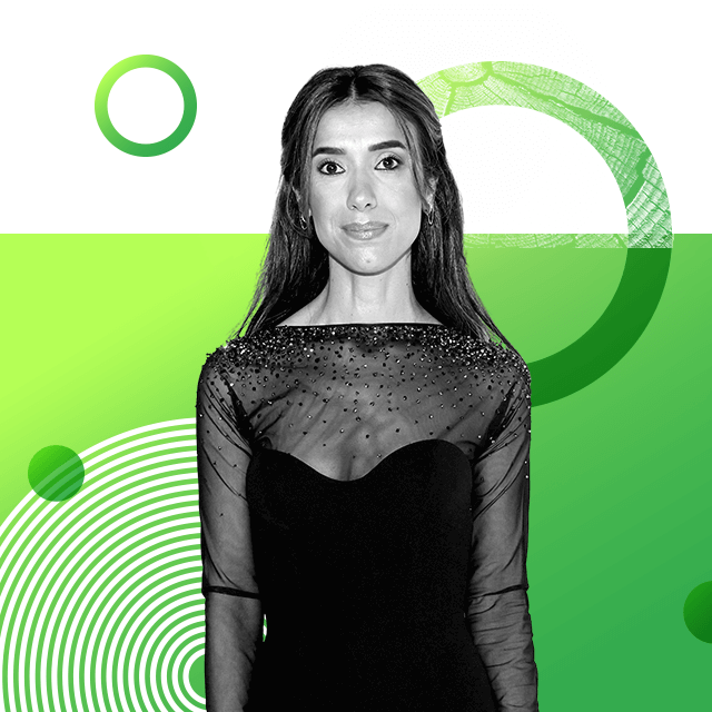 Nobel Peace Prize laureate Nadia Murad in a velvet dress with a top part made of sheer fabric and sequins, with her long hair neatly arranged.