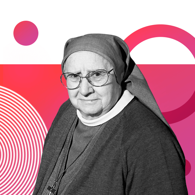 Nun Eugenia Bonetti wearing glasses, a full nun’s habit and cardigan, and a necklace with a cross.