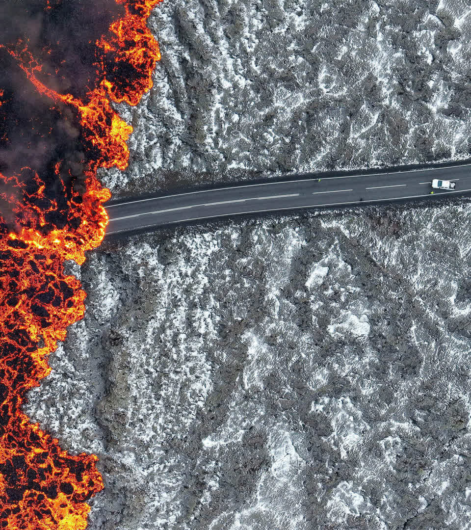 Lava flows across a road near Grindavik, Reykjanes Peninsula, Iceland, 21 November 2024.