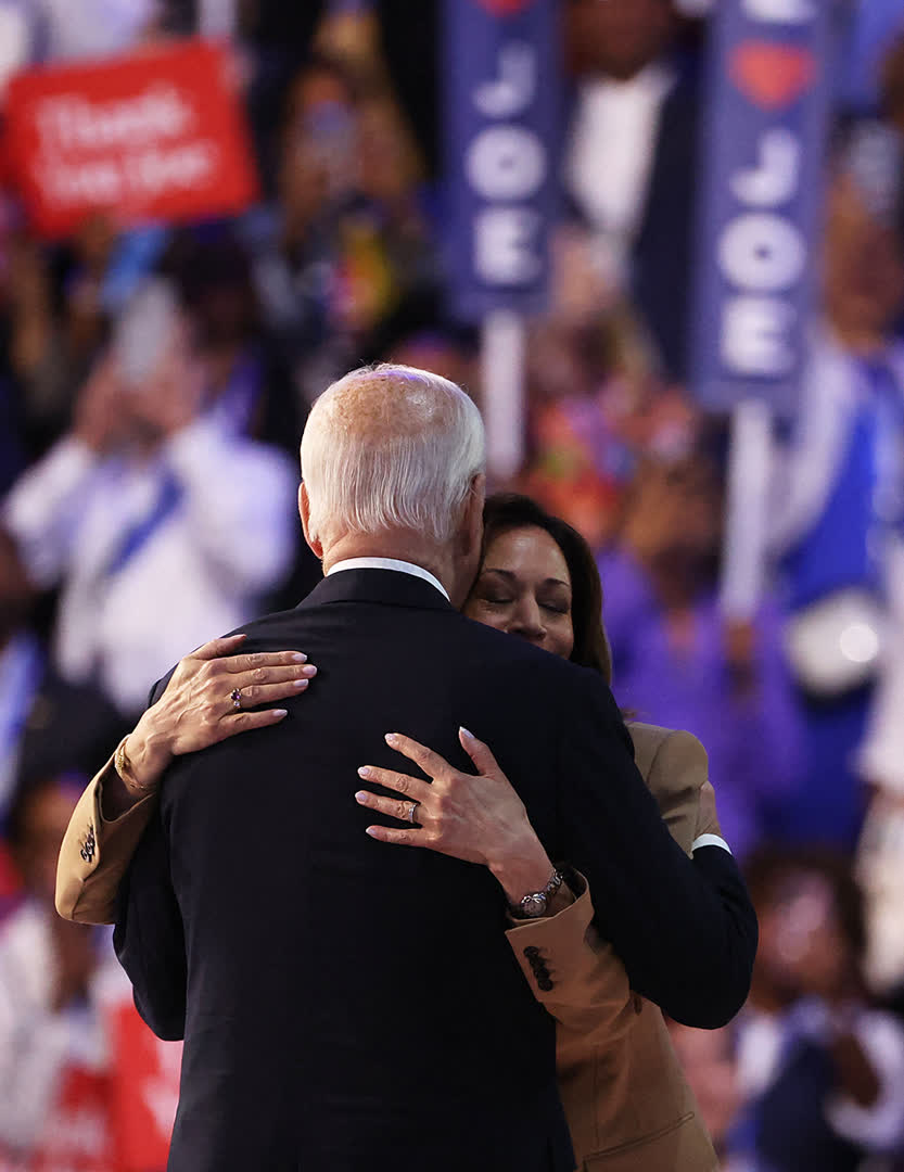 Democratic presidential candidate and US Vice President Kamala Harris embraces US President Joe Biden on stage during Day one of the Democratic National Convention (DNC) in Chicago, Illinois, U.S., August 19, 2024.