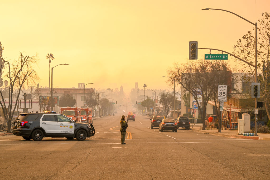 Police take security measures at the street during Eaton wildfire in Altadena, Los Angeles, California, on January 9, 2025