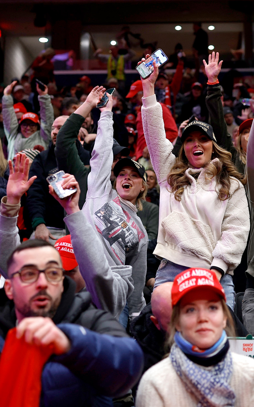 Attendees cheer inside Capital One arena ahead of an indoor rally on the day of the presidential inauguration of Donald Trump, in Washington, U.S. January 20, 202