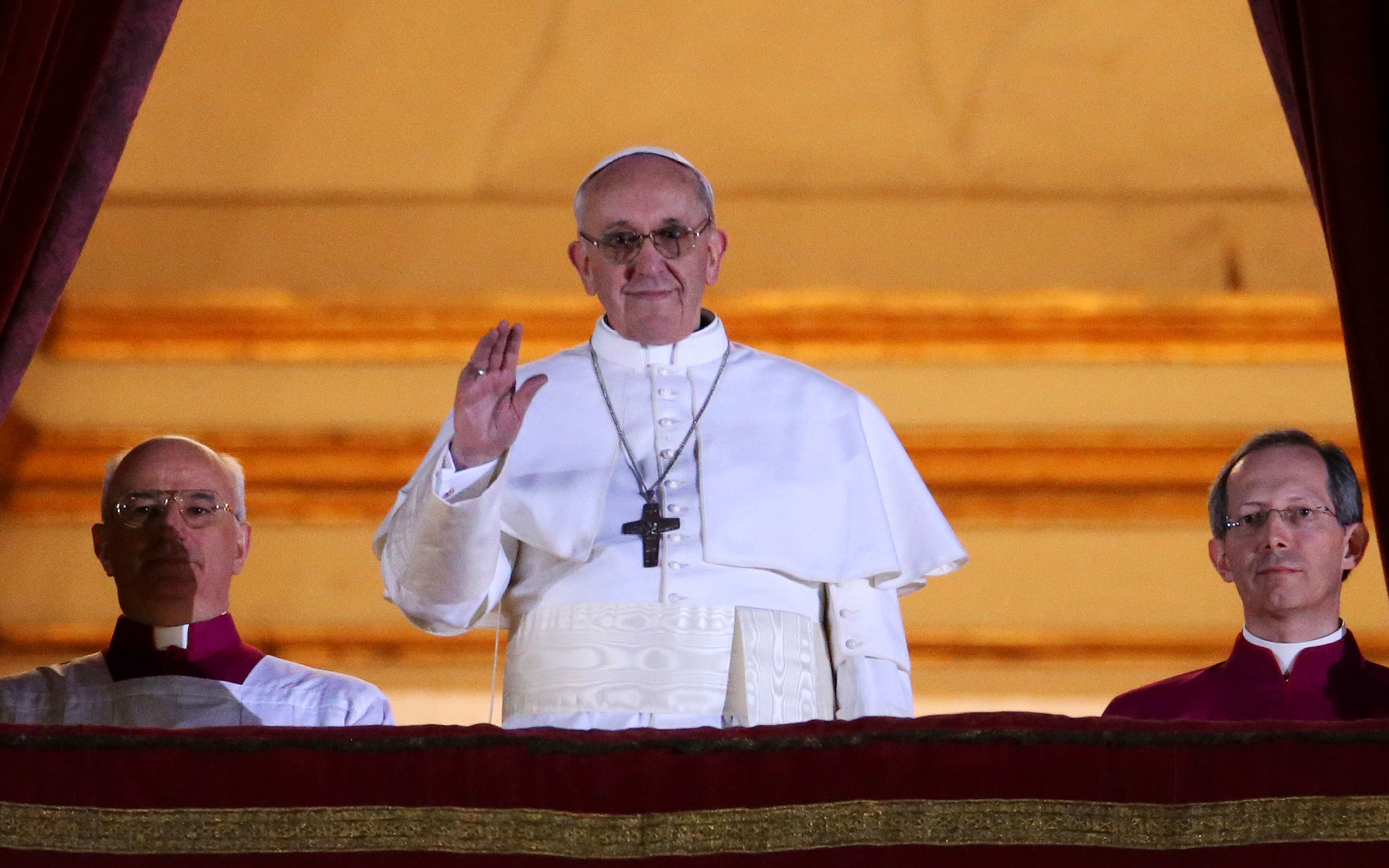 Newly elected Pope Francis I appears on the central balcony of St Peter's Basilica