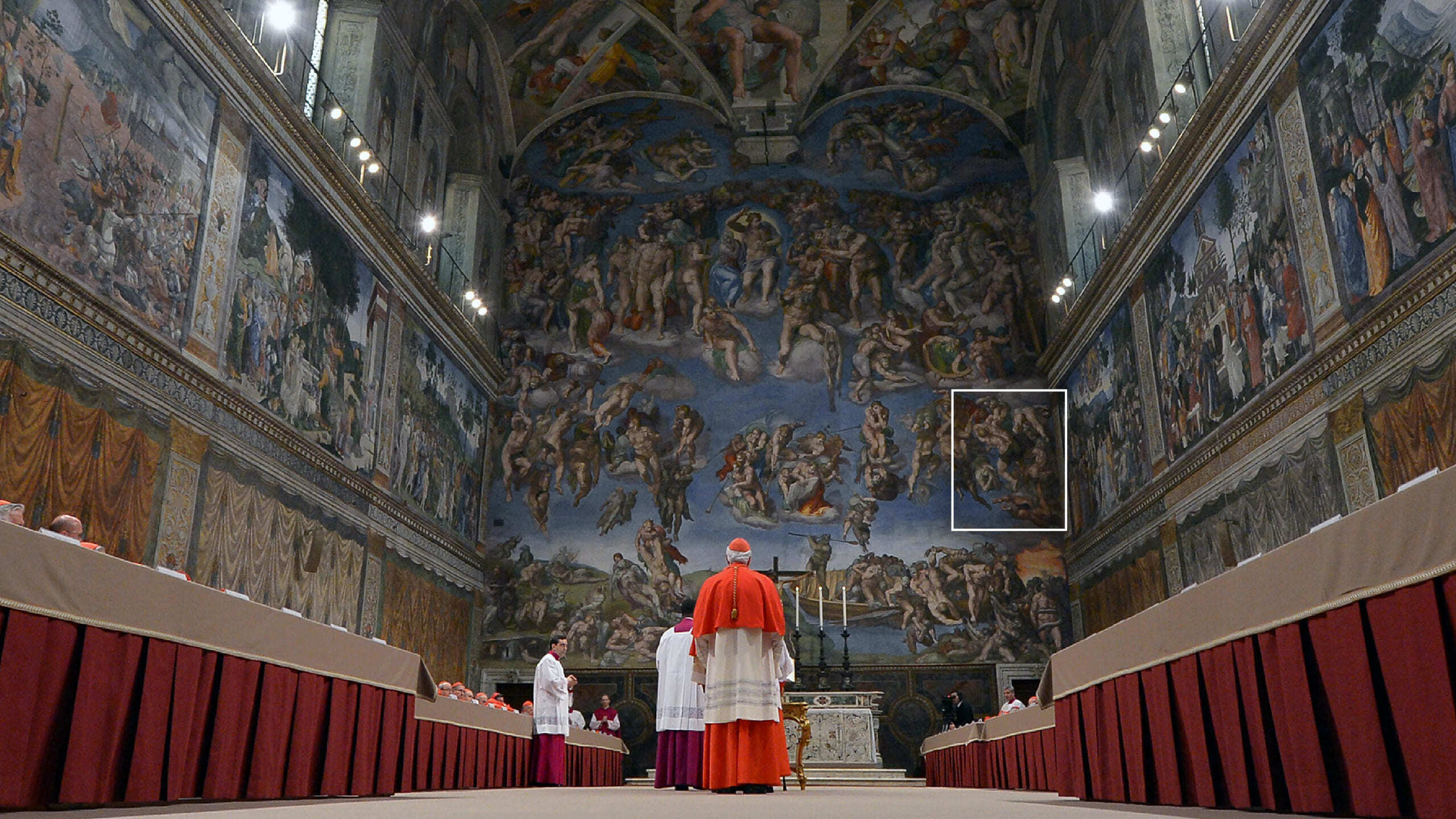 Photo of cardinals preparing for conclave in the Sistine Chapel in 2013 with a highlight in the Last Judgement fresco of souls being sent to Hell
