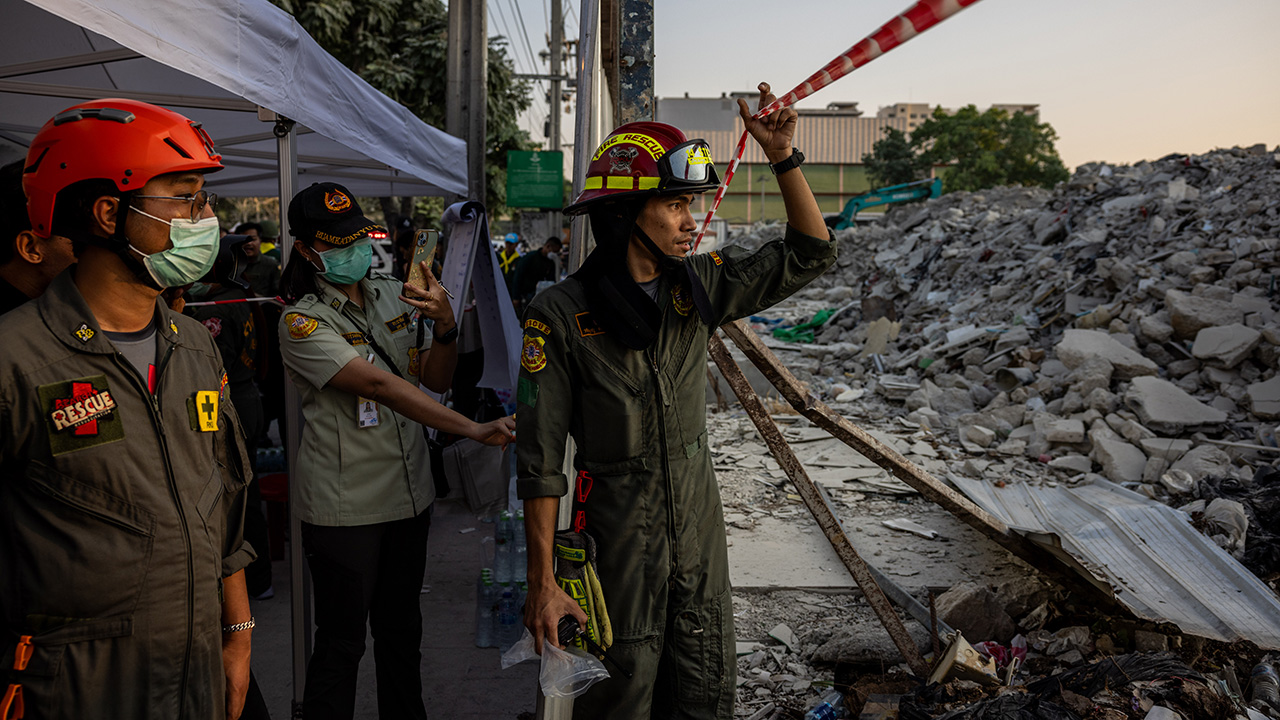 Thai rescue teams provide aid at a construction building collapse in Bangkok's Chatuchak area on March 28, 2025 in Bangkok, Thailand.