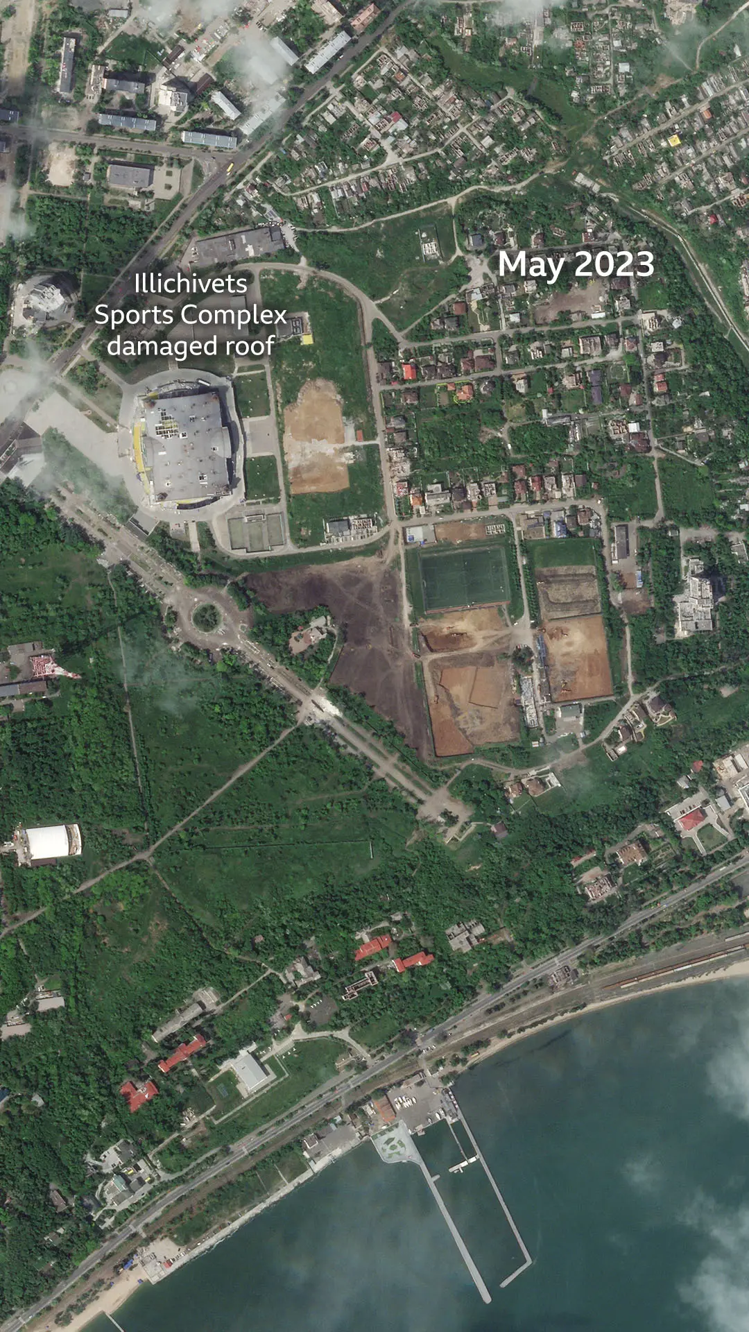 Satellite image of Mariupol acquired on 24 May 2023 shows the Illichivets Sports Complex roof damaged and an undevelopped part of the city.