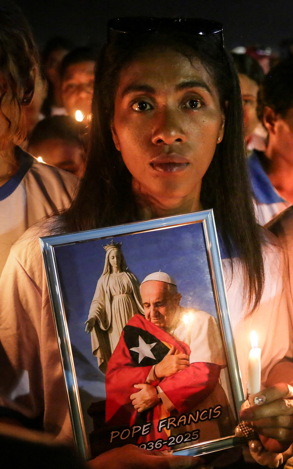 Catholic believers attending Pope Francis's requiem mass at the Esplanade of Tasitolu in Dili, East Timor