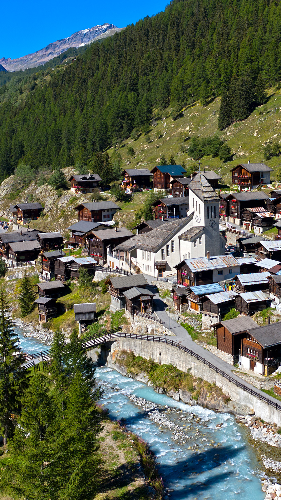 The church in the village of Blatten in Switzerland rises from the centre of the village before the landslide struck