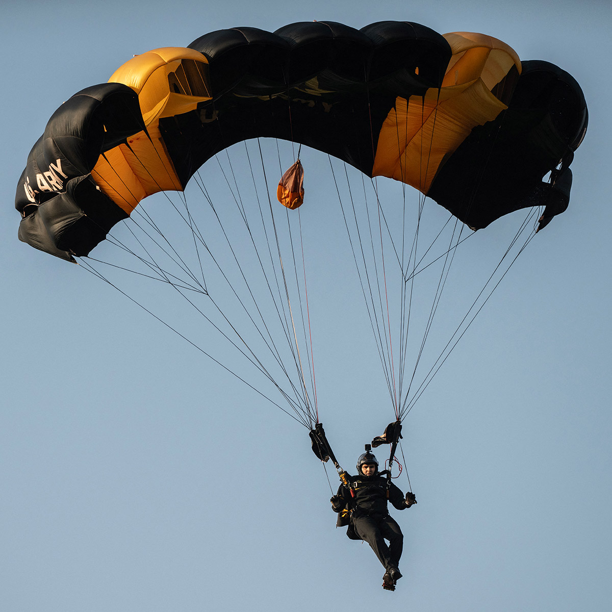 A member of the US Army Golden Knights parachute team performs at an event in Arlington, Virginia