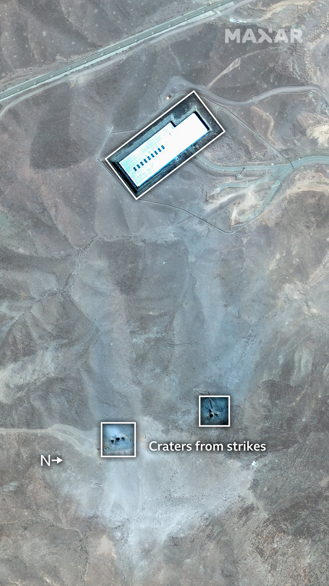 A satellite image of the Fordo site, showing craters after the strikes - two sets of holes grouped close together where there was only earth before. A grey dust is scattered all around