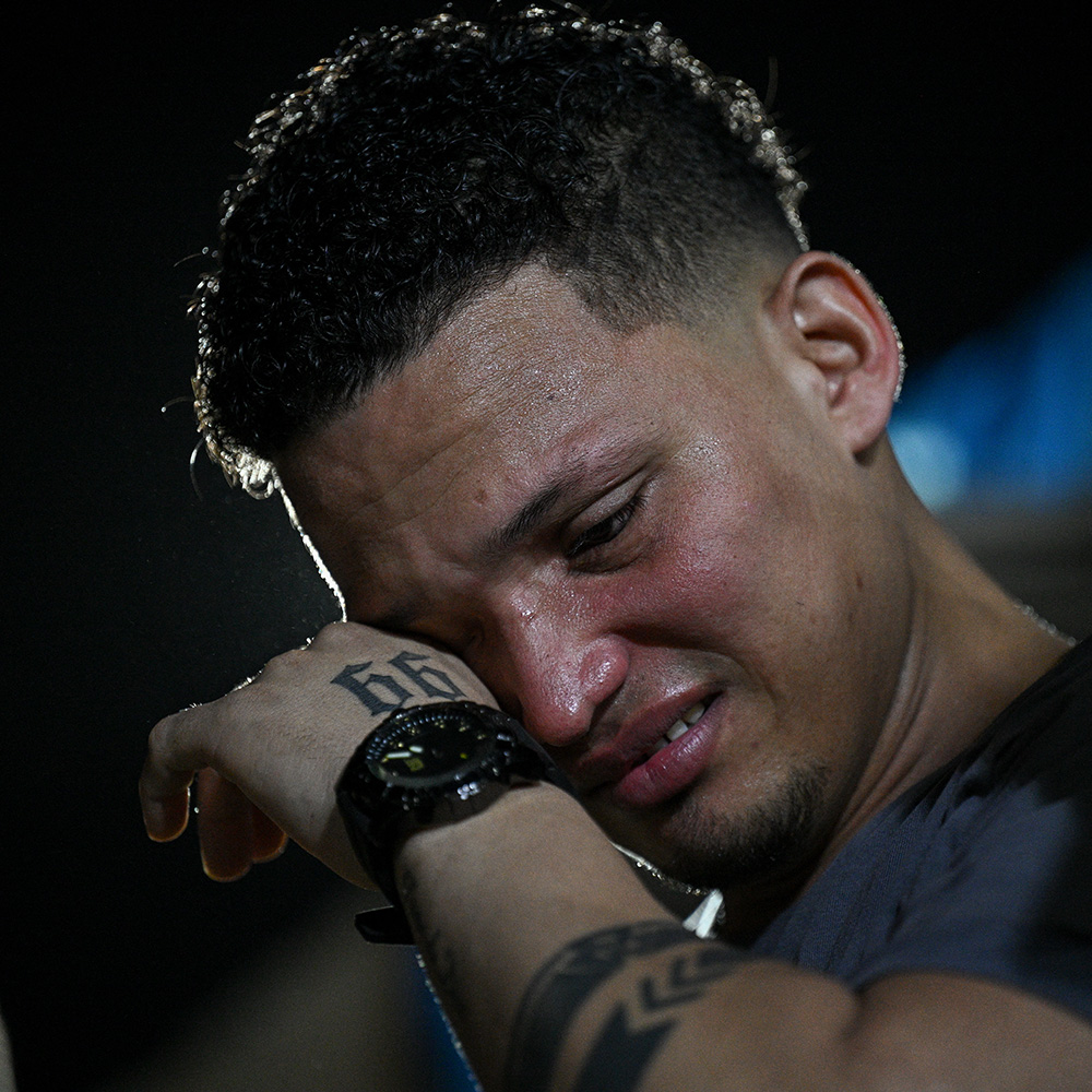 Mervin Yamarte cries during a service in his neighbourhood after his release
