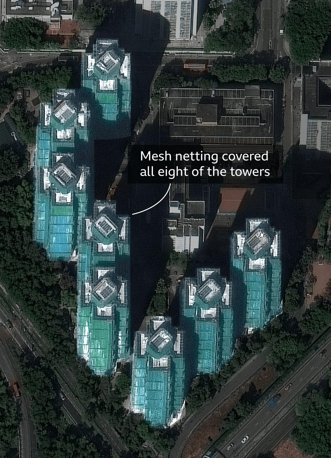 Satellite image taken before the fire shows how the buildings had all been draped in the mesh netting during the renovation work.