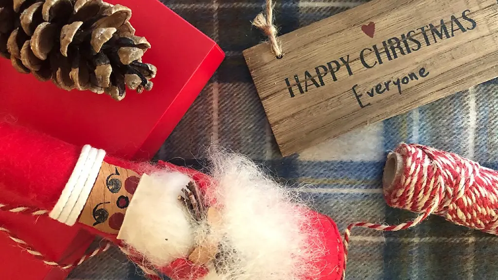 Couple taking a selfie in a crowd with Christmas lights behind in Tokyo (Credit: Getty Images)
