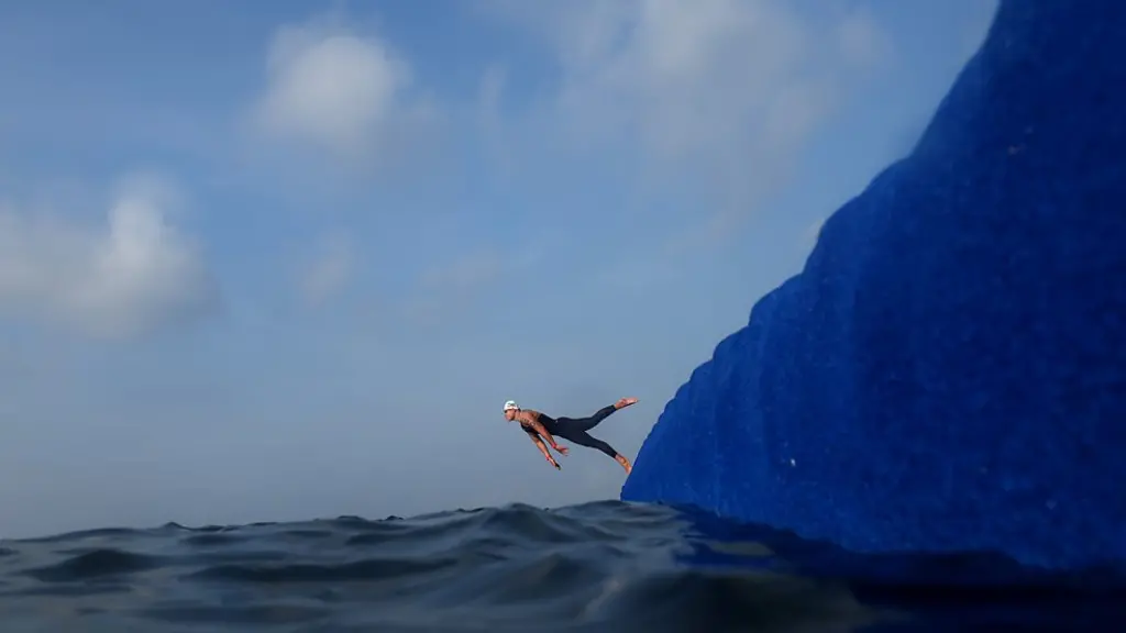 A group of monks praying beneath the vast golden dome of Wat Phra Dhammakaya during the ceremony of Makha Bucha