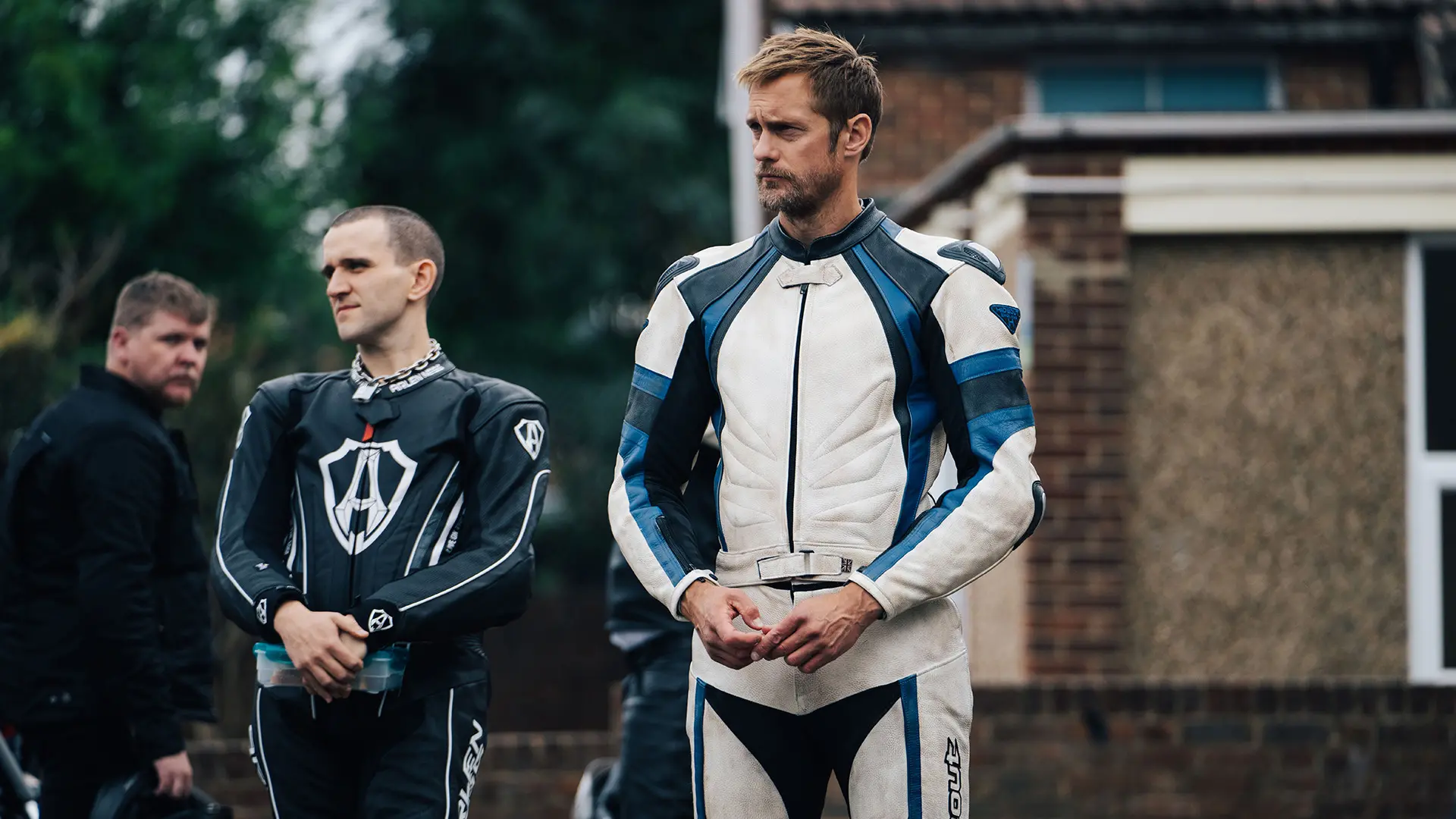 Alexander Skarsgård and Harry Melling wear biking leather in a still from the film Pillion