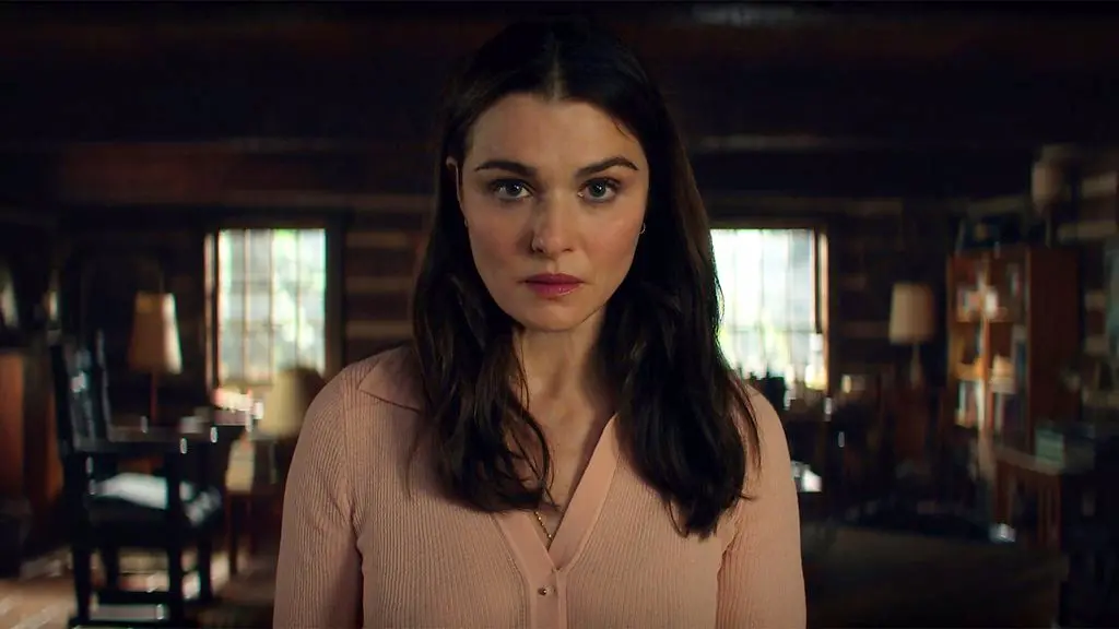 A still from Young Sherlock, showing a man in a suit in front of a horse and cart