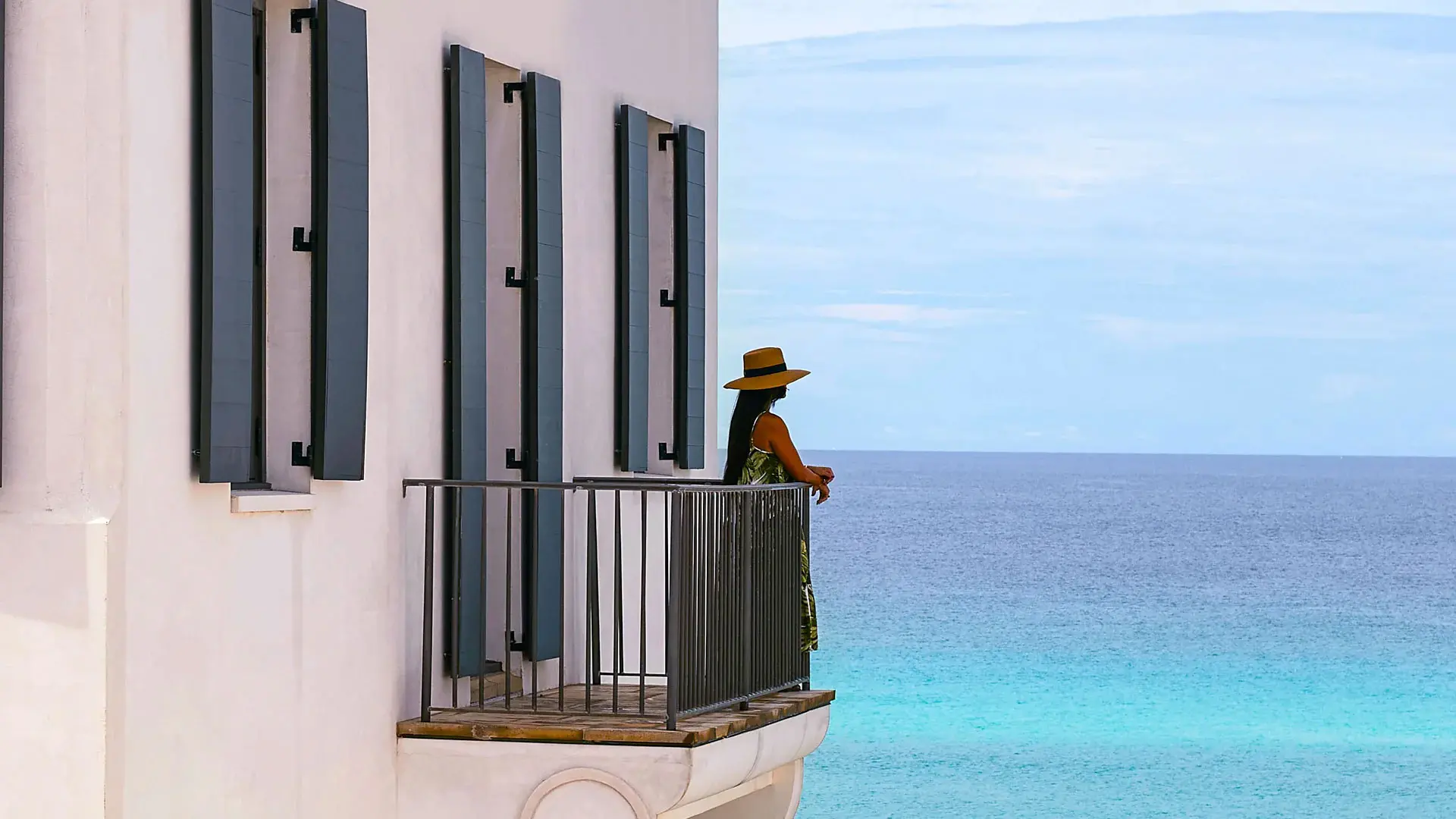 An aerial shot of a city where all the buildings are white and there is a bright blue sea in the distance (Credit: Moon Creek Studios, courtesy of Alys Beach, FL)
