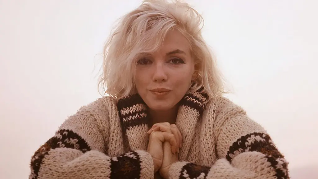 Marilyn Monroe with a beach towel around her shoulders, photographed on a beach in Santa Monica, California (Credit: Photo: George Barris u00a9 INHOLLYWOODLAND u2013 The George Barris Estate)