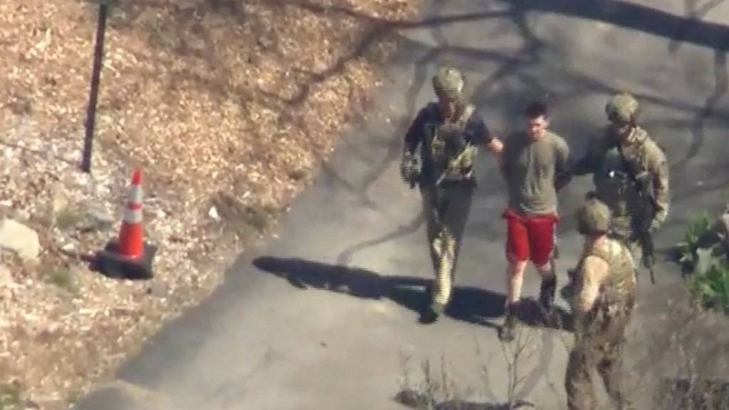 Screenshot of aerial footage showing the arrest of Jack Teixeira