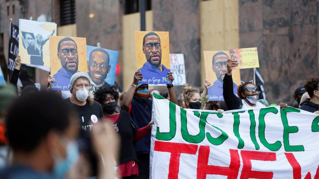 Protesters march on the first day of opening statements in the trial of former police officer Derek Chauvin, who is facing murder charges in the death of George Floyd, in Minneapolis, Minnesota, U.S., March 29, 2021
