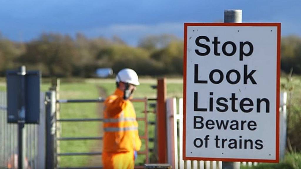 Stop looking. Safety Train. Don't Cross the Safety Barrier.