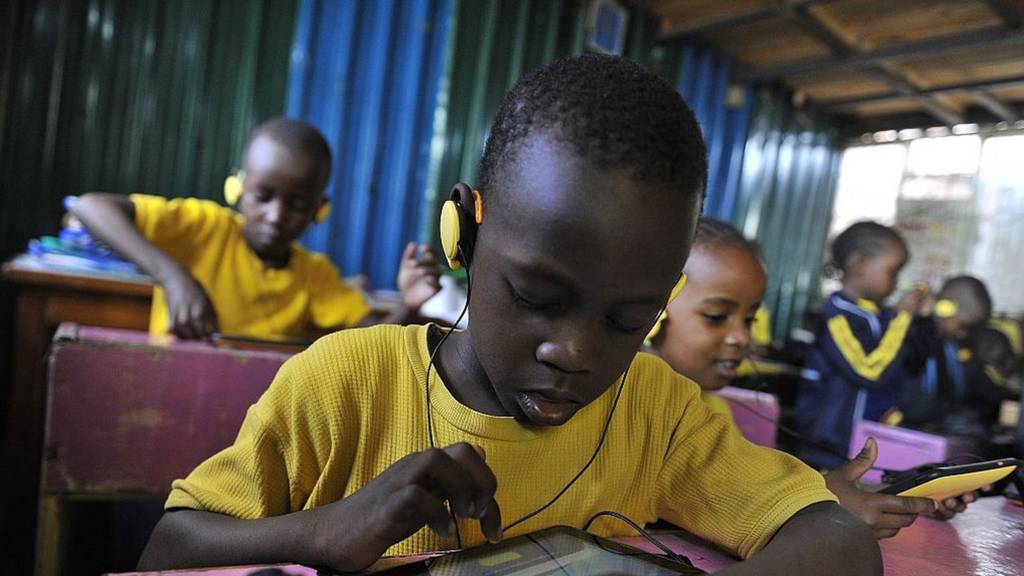 Pupil in Kenyan classroom with tablet computer