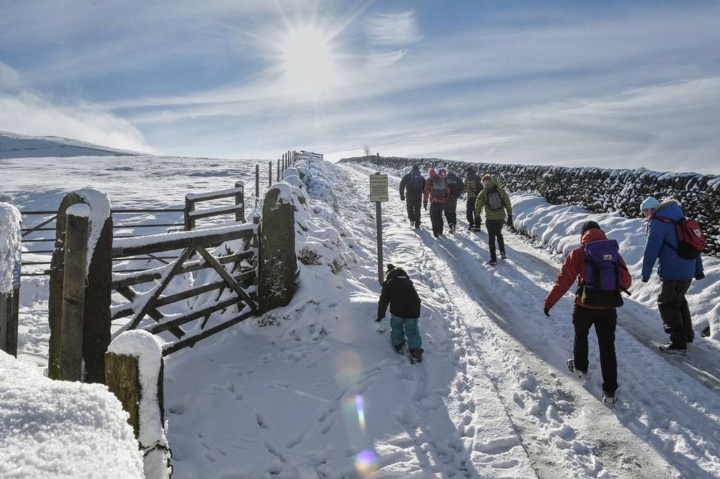 Walkers on a snow-covered path