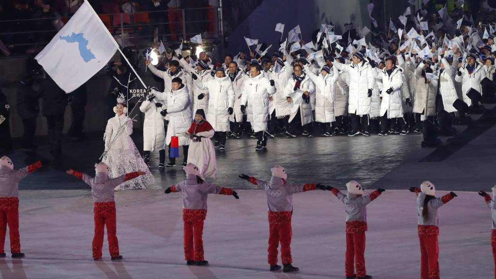 Korean athletes march under a unified flag