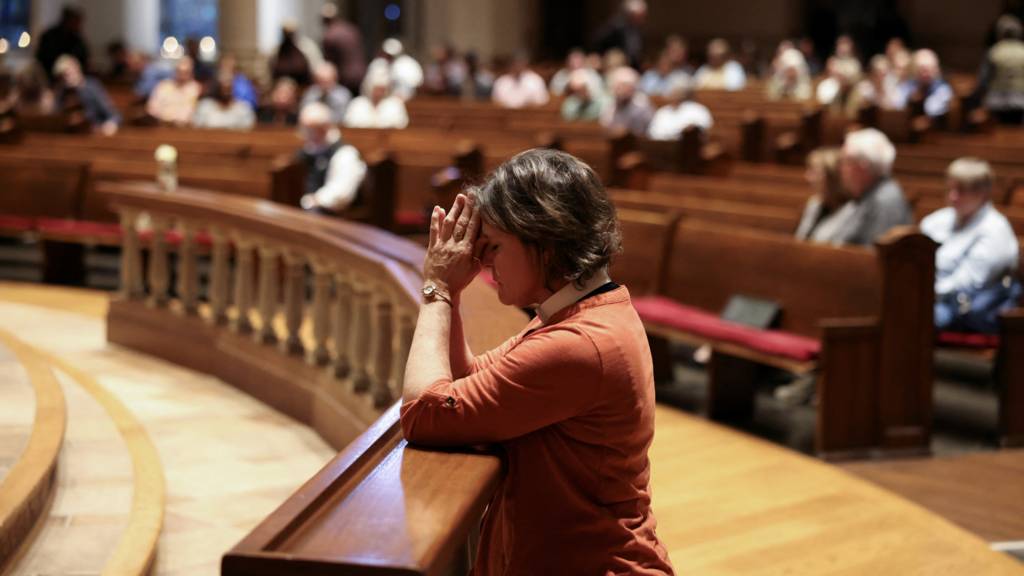 Rev. Dawn Bennett, a Pastor at The Table, prays during a community vigil held at Belmont United Methodist Church after the shooting at the Covenant School in Nashville.