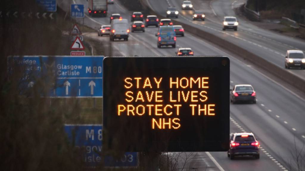 Stay home sign on motorway