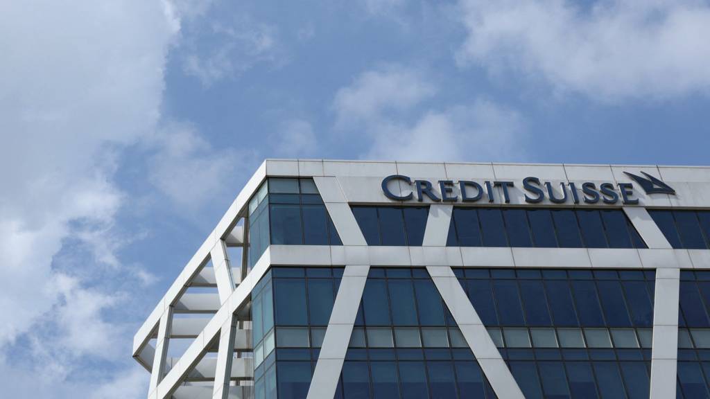 Exterior view of a building with a Credit Suisse sign