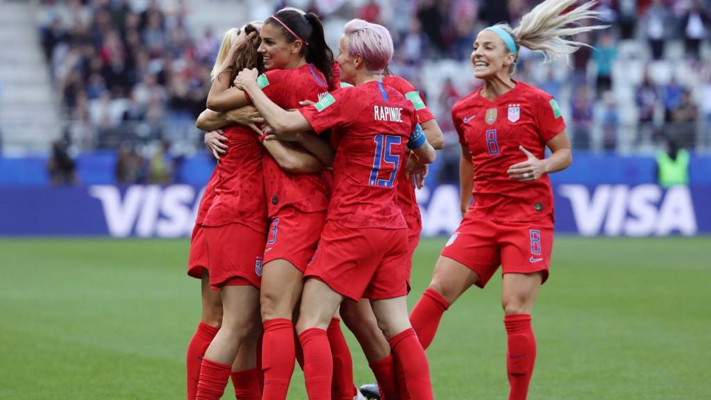 Alex Morgan celebrates with her teammates