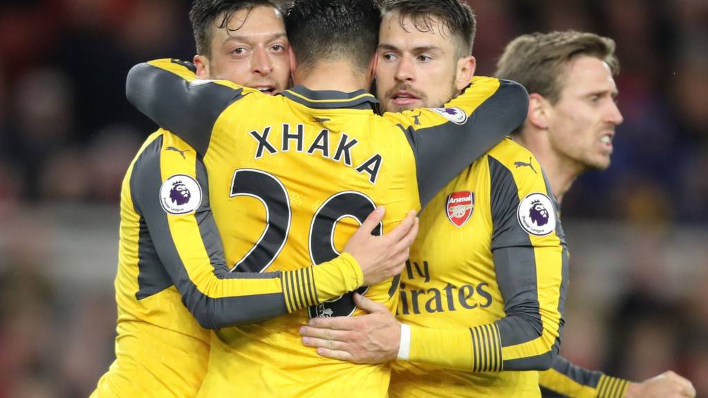 Mesut Ozil celebrates with his team mates