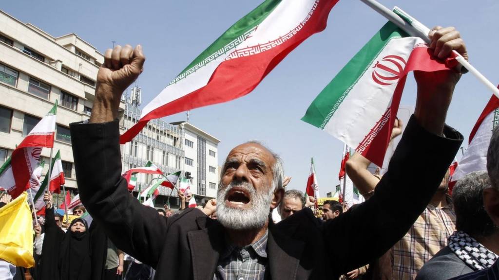 Iranians shout slogans and wave Iranian flags during an anti-Israel rally in Tehran, Iran, 19 April 2024