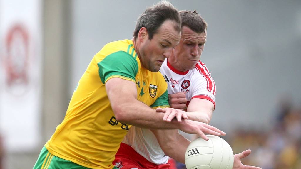 Donegal's Michael Murphy battles with Derry's Michael Bateson at Celtic Park
