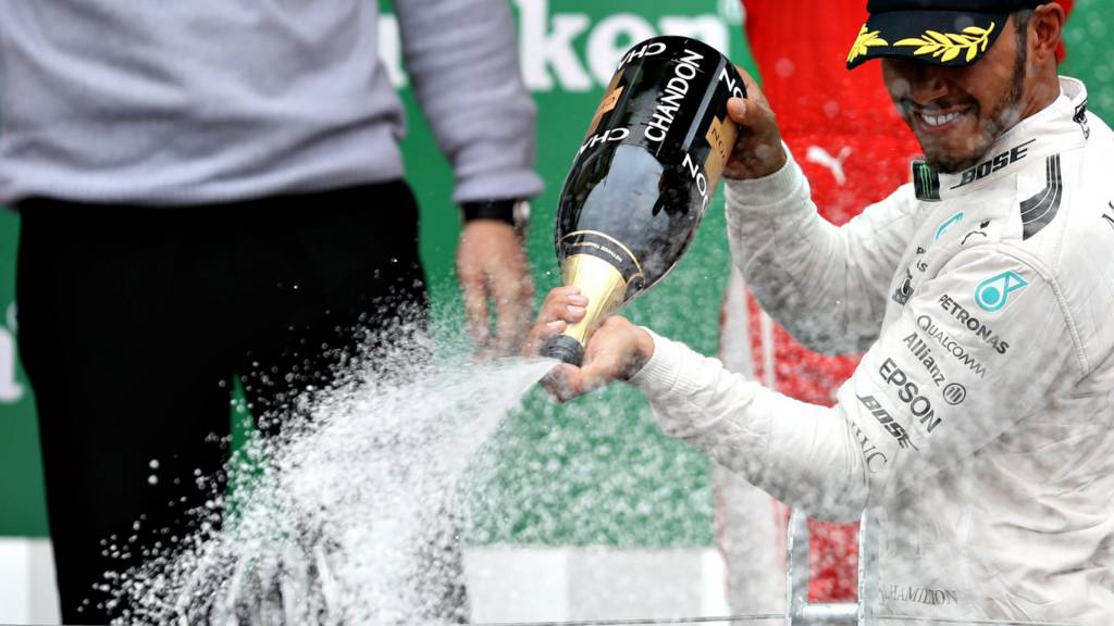 Lewis Hamilton celebrates winning