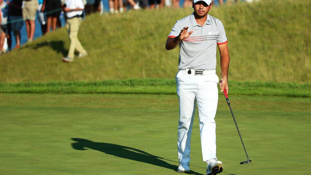 Jason Day waves to the gallery