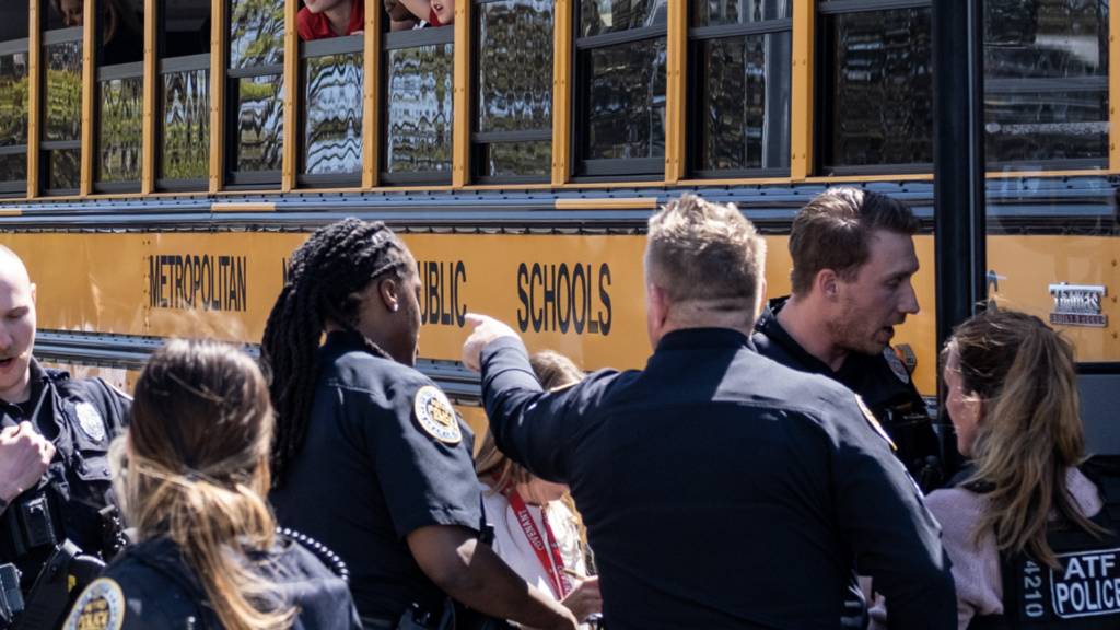 School buses with children arrive at Woodmont Baptist Church to be reunited with their families after a mass shooting at The Covenant School on March 27, 2023 in Nashville, Tennessee.