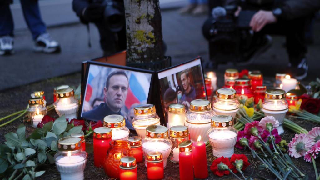 Candles next to the photo of Russian opposition leader Alexei Navalny during a vigil
